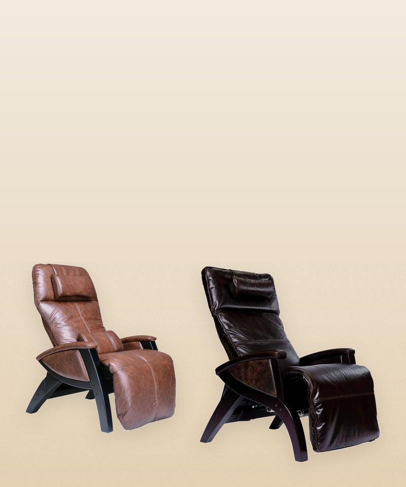 Two Svago zero gravity recliners, one in brown leather and one in dark brown leather