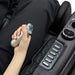 Osaki Platinum - Vanguard Duo 4D Massage Chair – hand holding the handheld health sensor beside the armrest